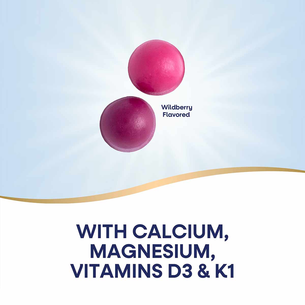 Two pink and purple round gummies labeled wildberry flavored with text listing calcium, magnesium, vitamins D3 and K1.