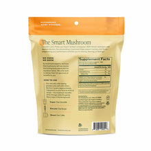 Om Mushroom Lion's Mane powder in a cream and orange pouch with supplement facts label and usage instructions.