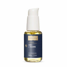 Clear glass bottle with white pump top containing golden-yellow liquid, labeled "Quicksilver Scientific Liposomal GABA + L-Th