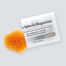 D-Spheric Magnesium packet with orange gel supplement beside white packet labeled with product information.