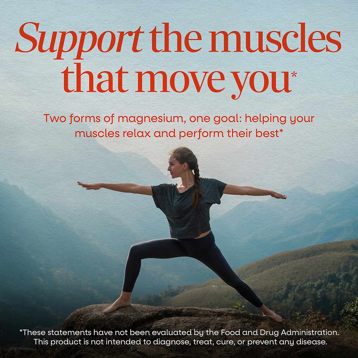 Woman in yoga pose on mountain overlook wearing dark shirt and black leggings.