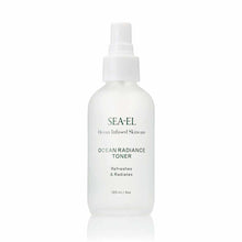A frosted white spray bottle with green text reading Sea-El Ocean Radiance Toner, 120 ml, stands against a plain white background.