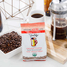 Tyler's Coffee 12 oz organic decaf whole bean coffee package displayed with whole beans in bowl and brewed coffee.