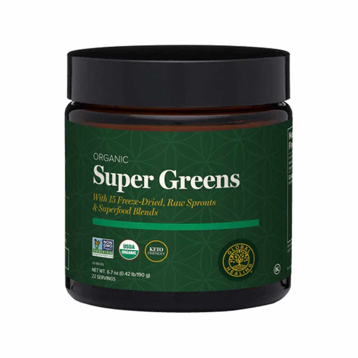 Dark glass jar with black lid containing green-labeled Organic Super Greens powder with certification logos.