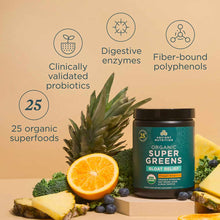 Dark glass jar of Ancient Nutrition Organic SuperGreens + Bloat Relief surrounded by pineapple, orange, broccoli, and berries