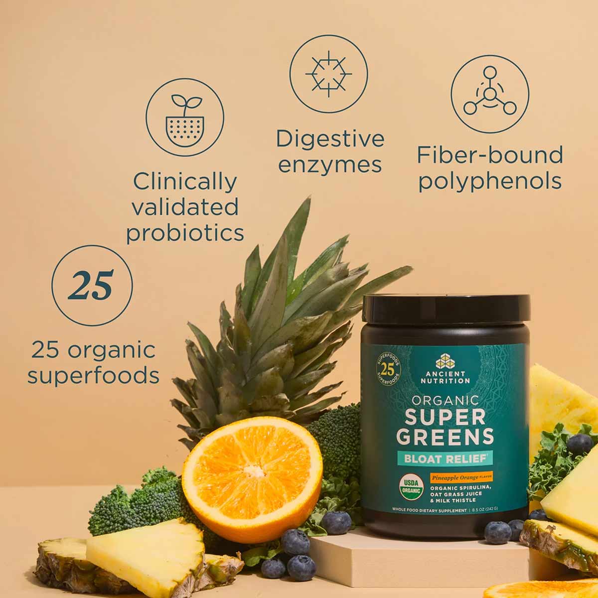 Dark glass jar of Ancient Nutrition Organic SuperGreens + Bloat Relief surrounded by pineapple, orange, broccoli, and berries