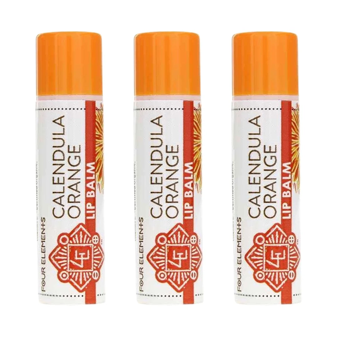 Three cylindrical lip balm tubes with orange caps, white labels reading "Calendula Orange Lip Balm" and "Four Elements" brand