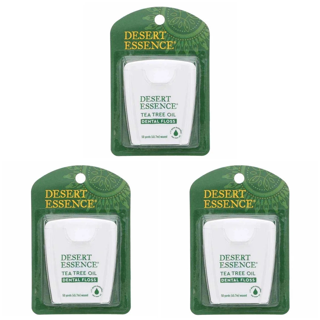 Three green Desert Essence tea tree oil dental floss packages, each containing 50 yards, displayed in packaging with white pr