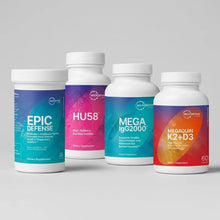 Four Microbiome Labs supplement bottles: Epic Defense, HU58, Mega Spore, and MegaQuin K2+D3 dietary supplements.