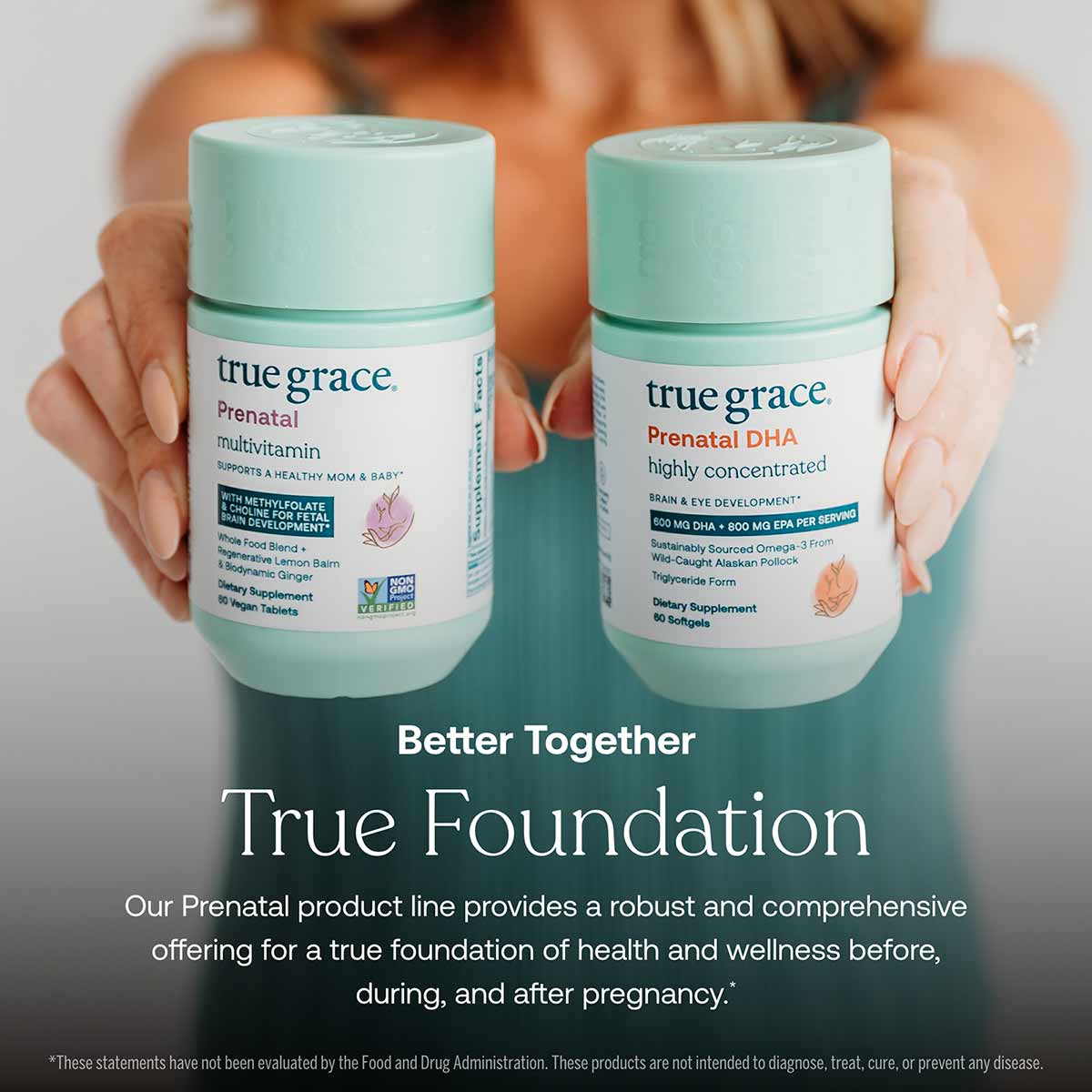 Two mint-green True Grace prenatal supplement bottles held by a person, labeled Prenatal Multivitamin and Prenatal DHA with 6