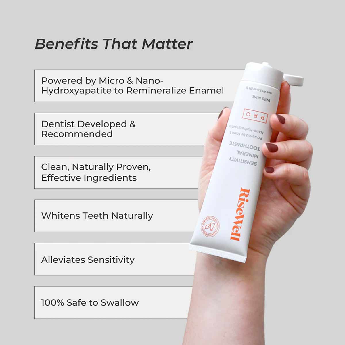 White RiseWell PRO Mineral Toothpaste tube held in hand with benefits text listed on left side.