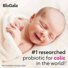 Sleeping infant wrapped in white blanket with BioGaia logo and text about probiotic drops for colic.