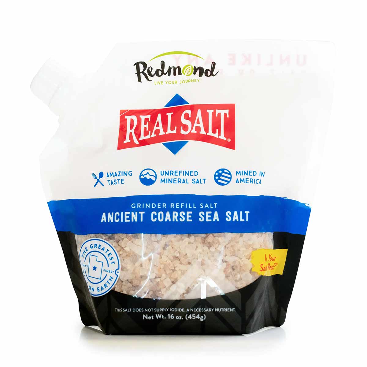 Redmond Real Salt coarse sea salt pouch with white and tan crystals visible through clear window, 16 oz.