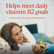 Nature's Way Riboflavin Vitamin B2 100 mg supplement package with text and woman holding cereal bowl.