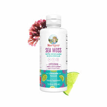 White liquid supplement bottle labeled Sea Moss with Spirulina and Chlorella, 7.6 fl oz, with lime slice and pink flower besi