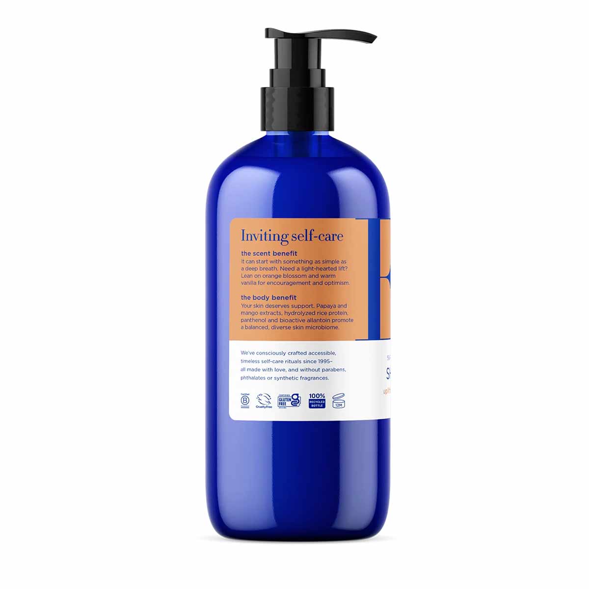 Blue glass bottle of EO Products shower gel with black pump dispenser and product information label.