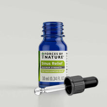 Blue glass bottle labeled "Forces of Nature Sinus Relief Maximum Strength" with black dropper cap beside it.