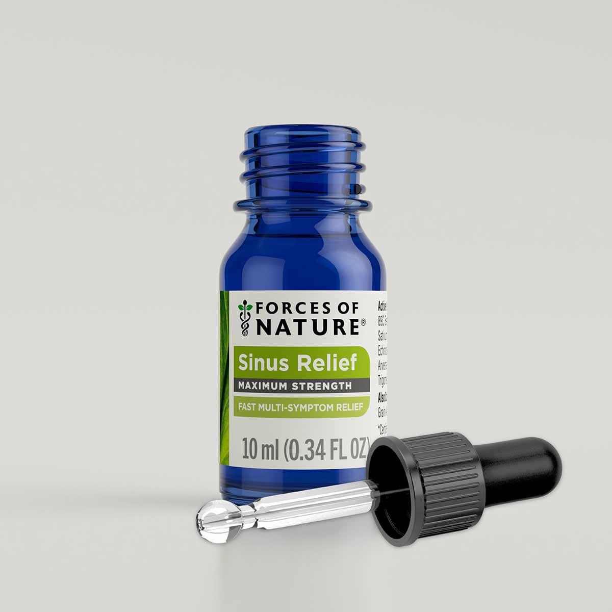 Blue glass bottle labeled "Forces of Nature Sinus Relief Maximum Strength" with black dropper cap beside it.