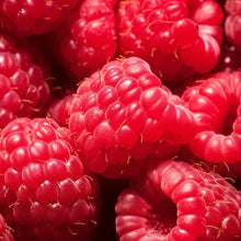 Close-up of fresh red raspberries with small stems visible.