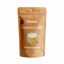 Blume Superfood Latte powder in Salted Caramel flavor, tan pouch with product image and ingredient badges.