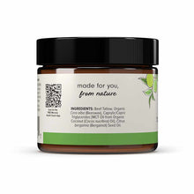 Amber glass jar with black lid containing tan-colored balm, labeled with ingredient list and green botanical design.