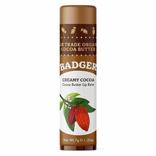Badger Creamy Cocoa Cocoa Butter Lip Balm stick with brown and white label featuring red cocoa pod illustration.