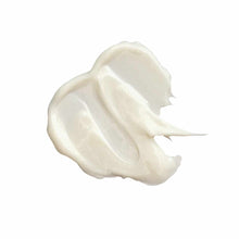 Creamy white body butter with a thick, whipped texture and soft peaks.