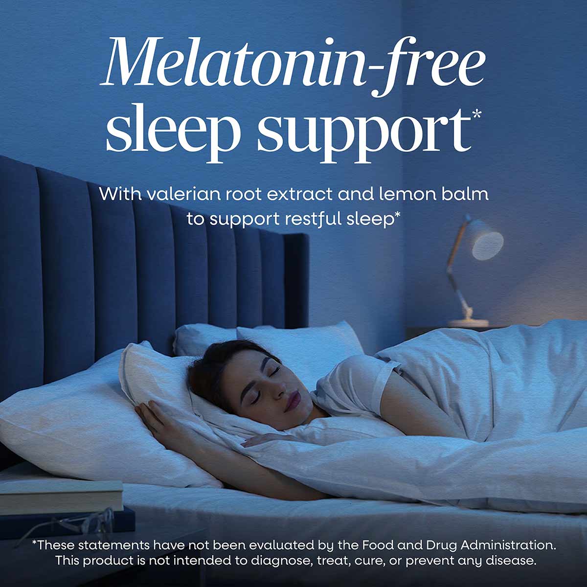 Bottle of Valerian Nighttime Premium Blend supplement with blue headboard and bedding in background.