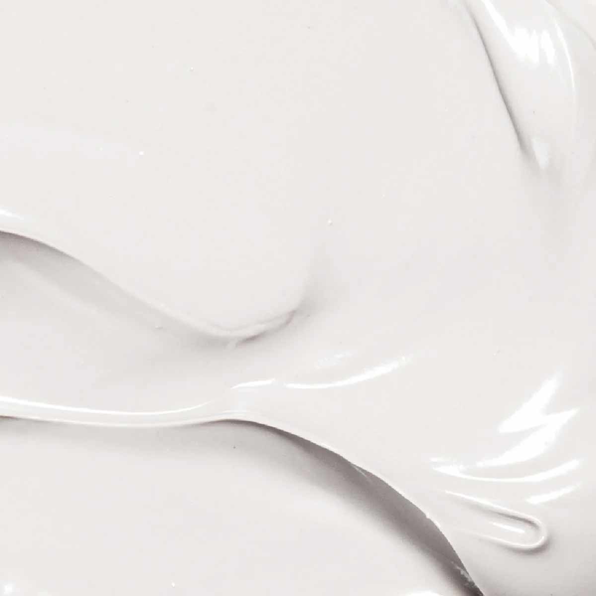 White creamy body lotion with smooth, glossy texture swirls.