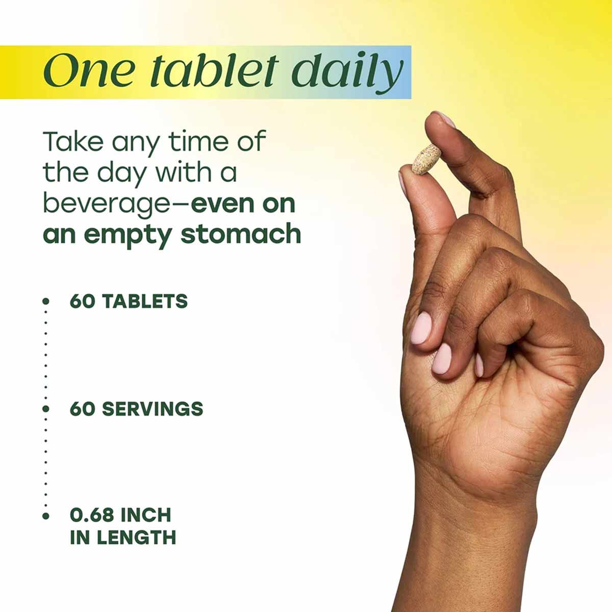Hand holding a single beige multivitamin tablet against a yellow gradient background with product details listed.