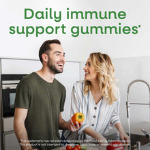 Bottle of Zinc Gummies 11 mg by Nature's Way displayed with two people in a kitchen holding fresh vegetables.
