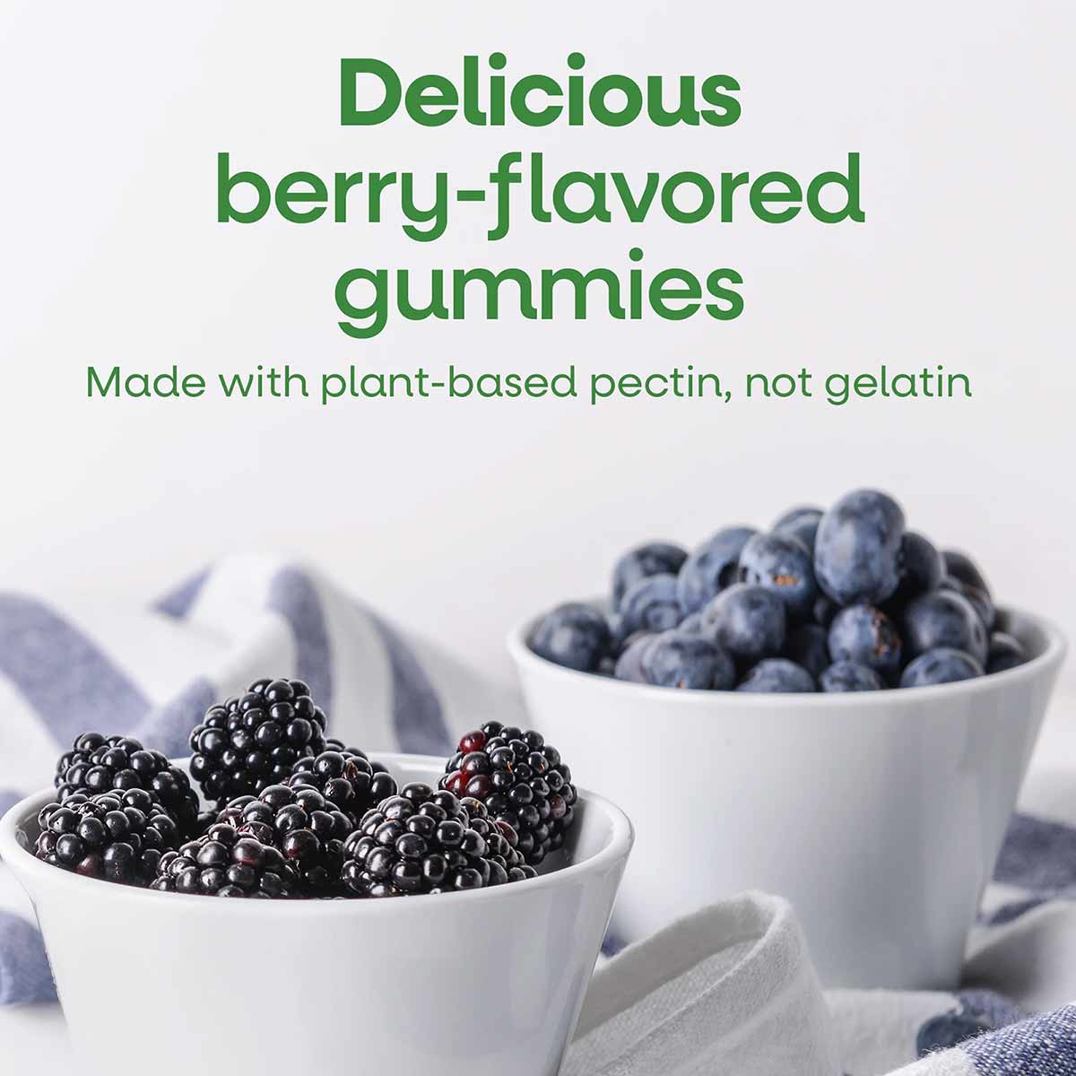 Berry-flavored gummies in white bowls with blackberries and blueberries, text describing plant-based pectin formula.